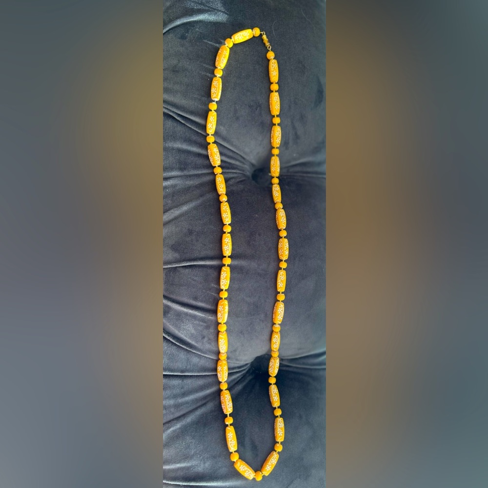 Vintage style yellow necklace with flower design